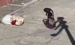 Eşini bayılıncaya kadar sokak ortasında dövdü!